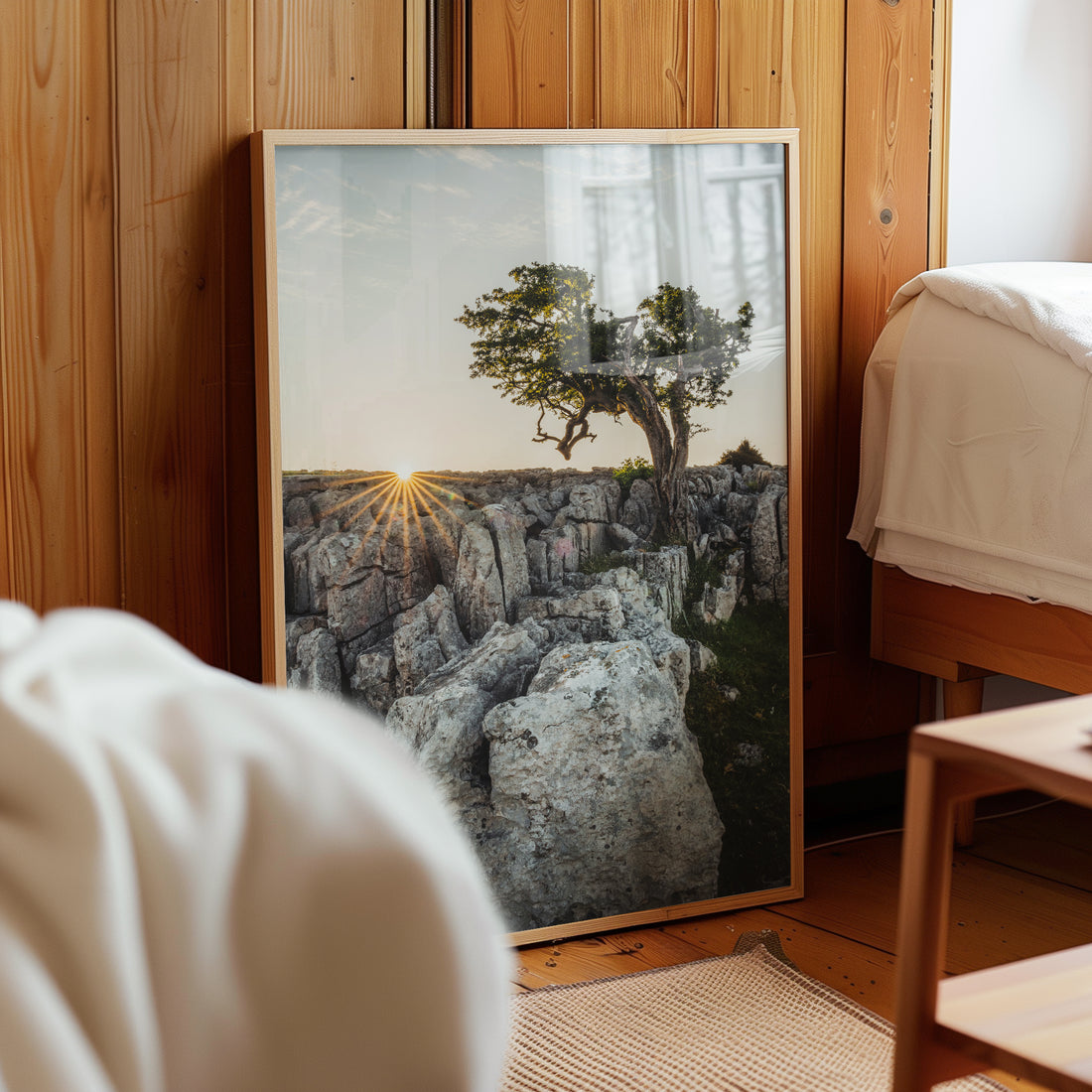 Twistleton tree print leaning against a wooden wall interior