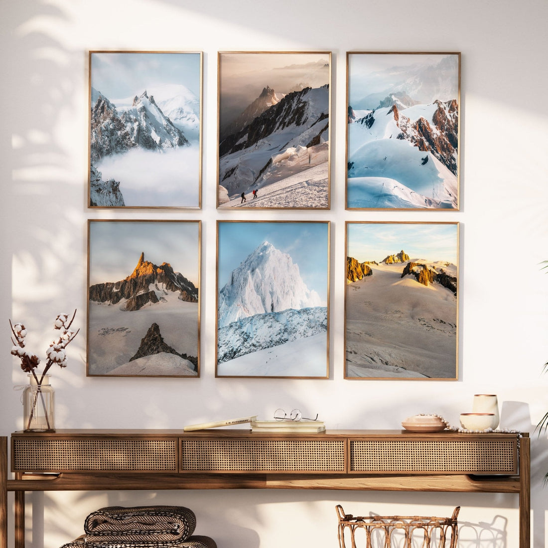 Modern living room with a gallery wall of six framed Chamonix mountain landscape prints.