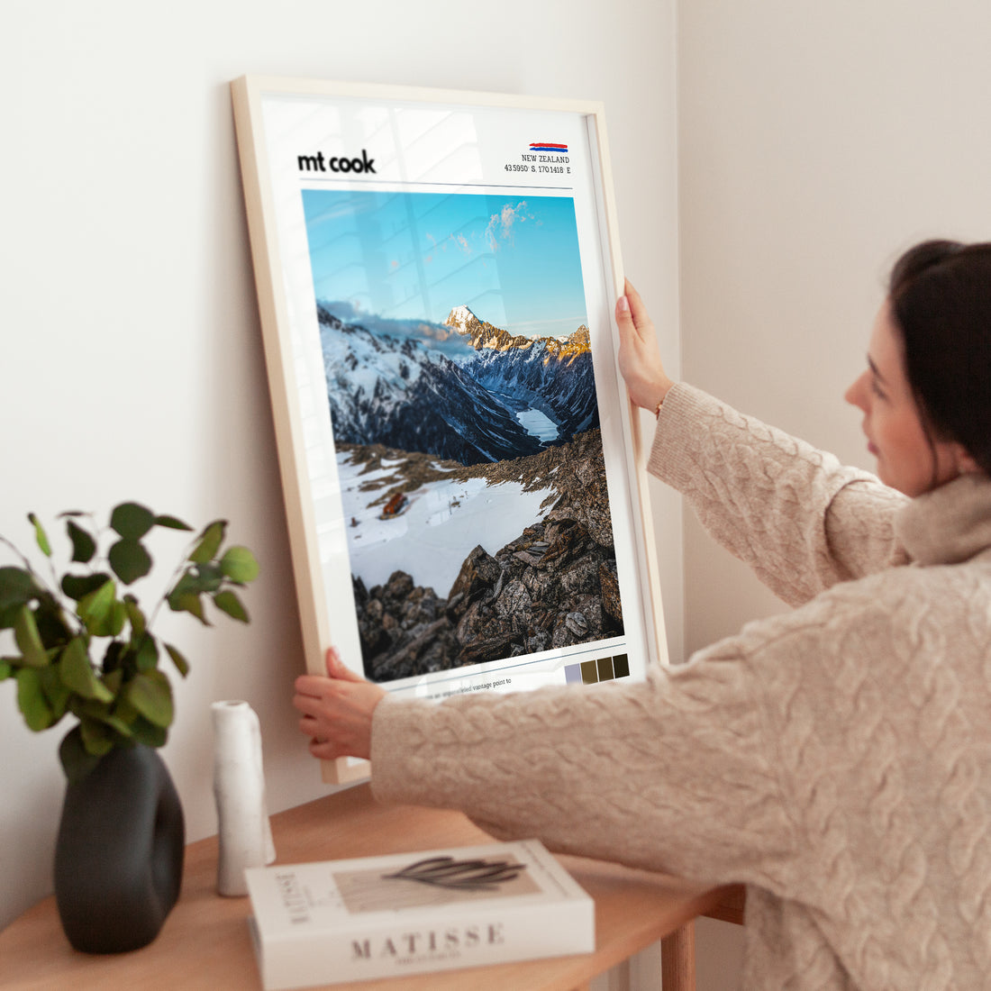 Person hanging a Mt Cook wall art print featuring the alpine landscape near Mueller Hut in Aoraki Mount Cook National Park, New Zealand