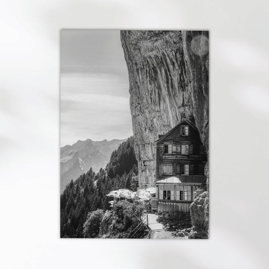 Stunning black-and-white print of Aescher Guesthouse, a famous Swiss cliffside hotel in the Alps.