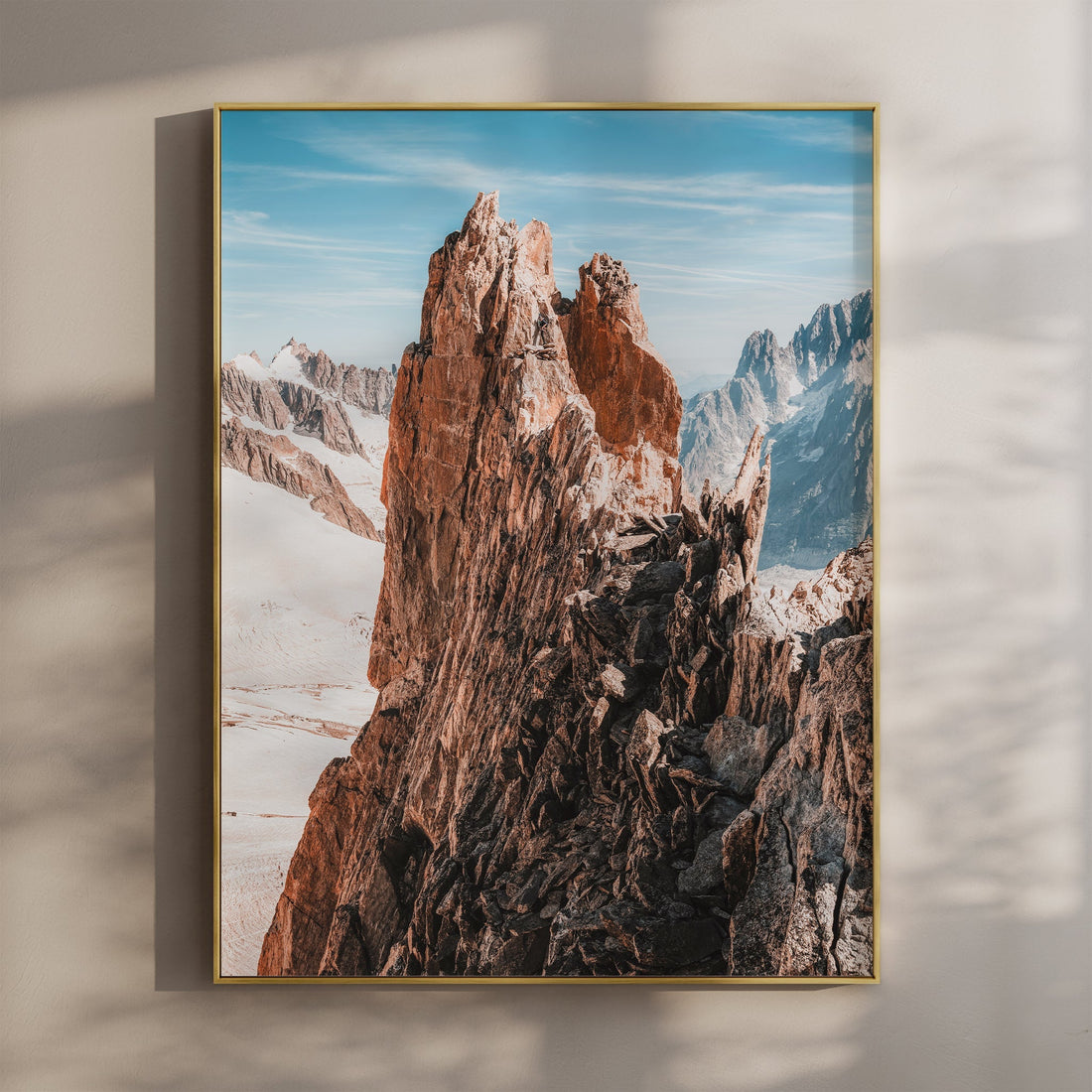 Stunning Aiguille d'Entrèves mountain wall art print featuring rugged peaks against a vibrant blue sky.