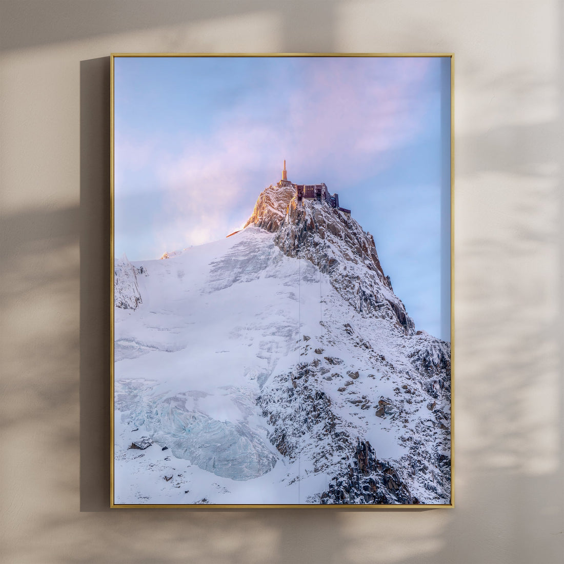 Breathtaking Aiguille du Midi summit print, featuring snowy peaks and golden light over Chamonix.
