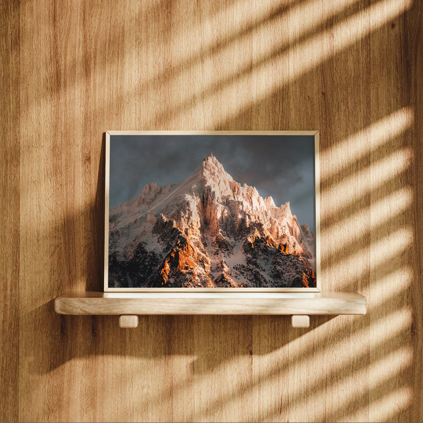 Fine art landscape print of Aiguille du Midi bathed in golden sunlight, shot from Chamonix, France.