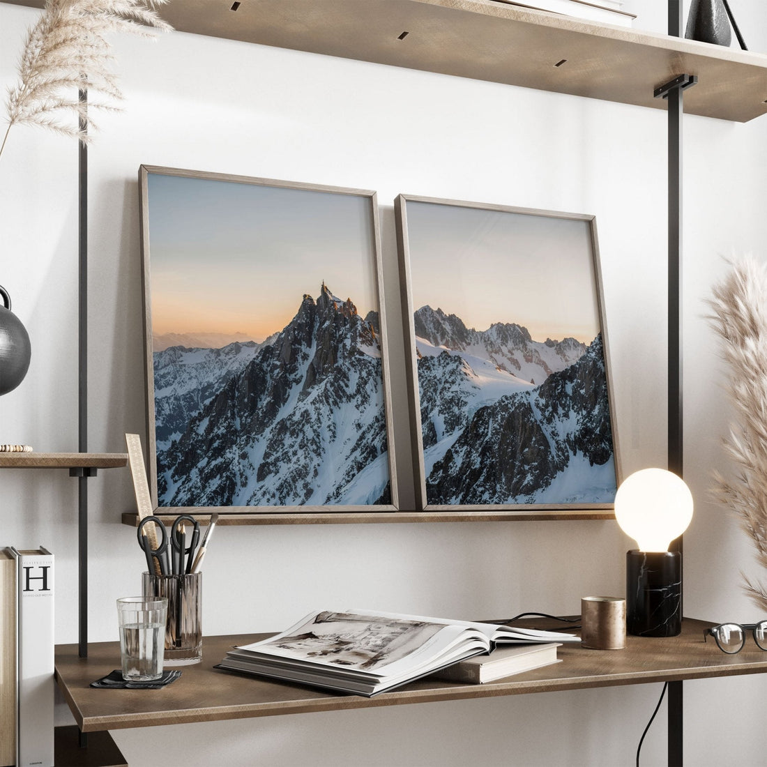 Framed Aiguille du Midi photography showcasing snowy peaks, styled on a floral wallpaper background