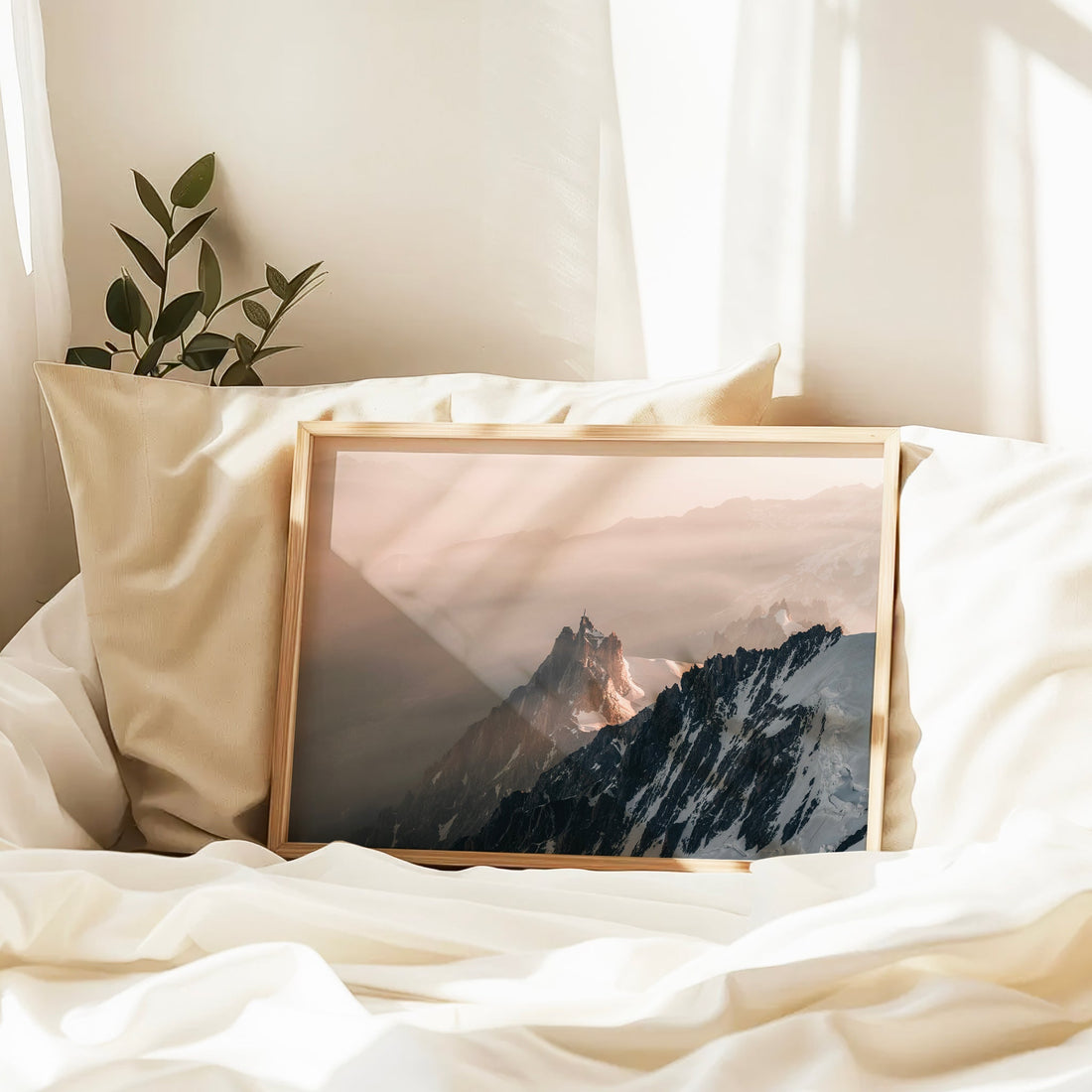 Framed Aiguille du Midi wall art print showcasing the dramatic ridgeline and golden mist of the French Alps.