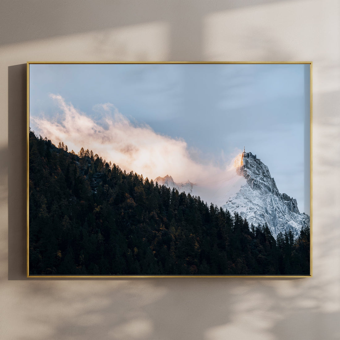 Fine art print of Aiguille du Midi glowing in golden light above alpine forest near Chamonix, France.
