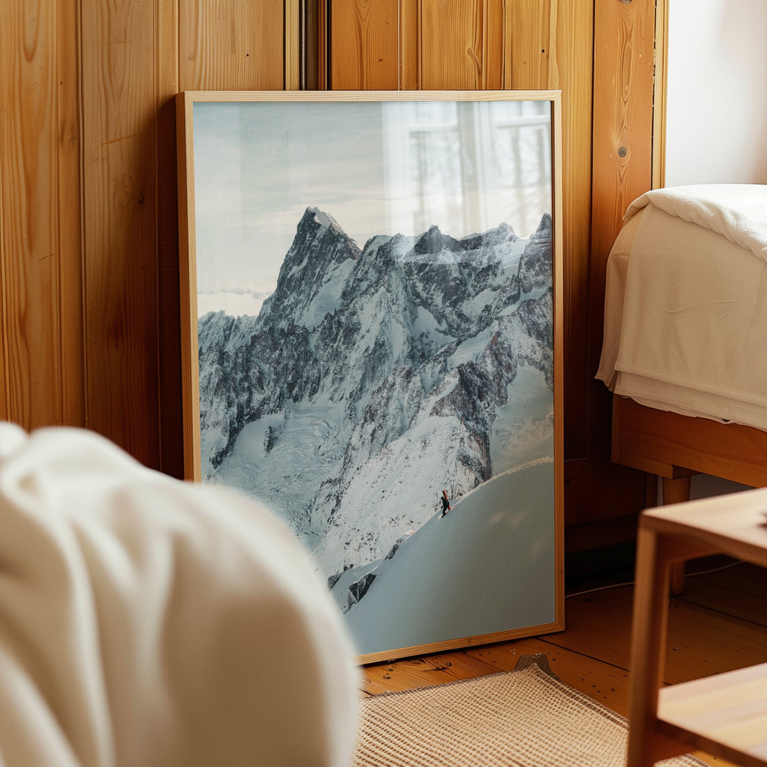 A striking photography print of a skier making their way down the iconic Aiguille du Midi ridge.