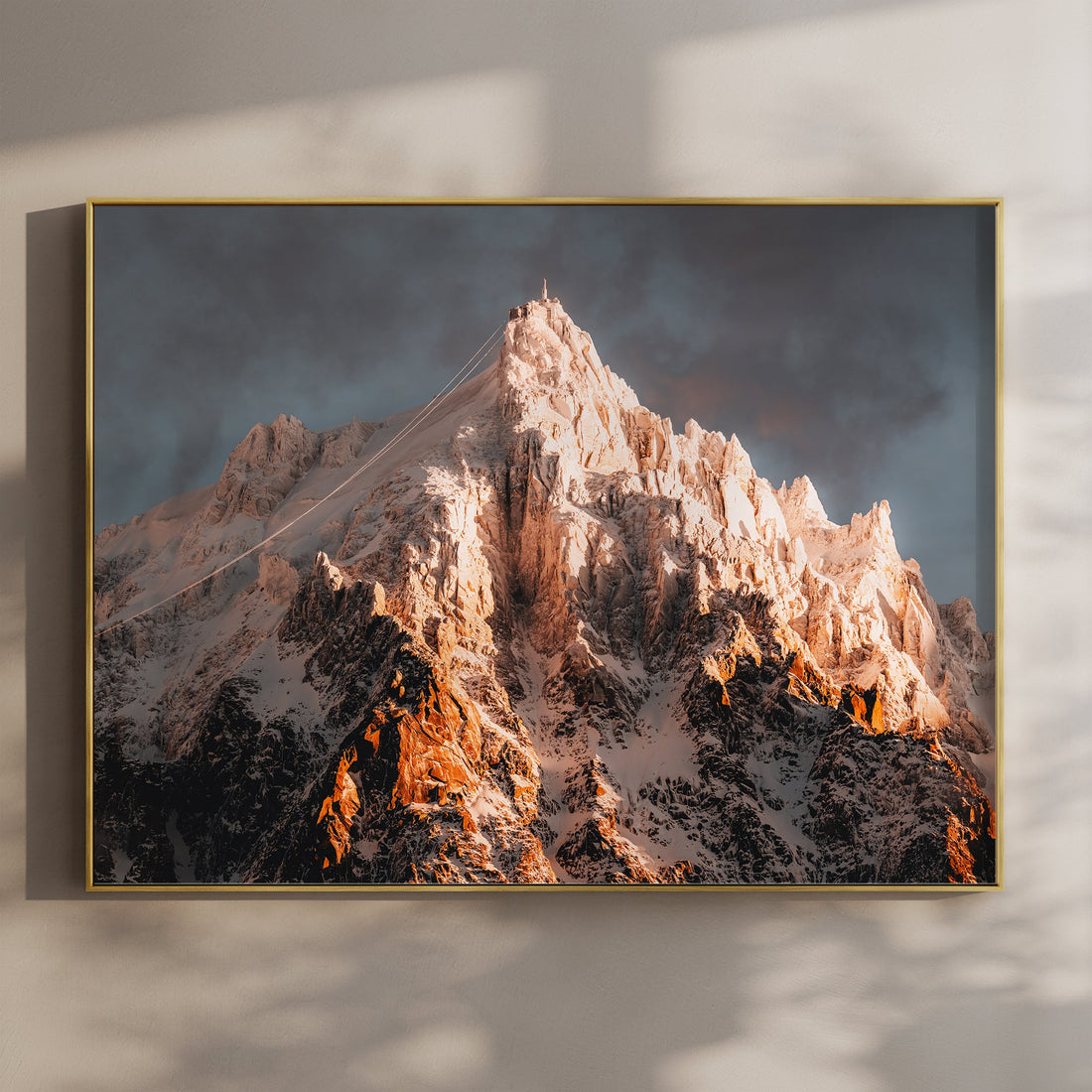 Aiguille du Midi sunrise wall art print featuring dramatic morning light over the Chamonix peaks in winter.