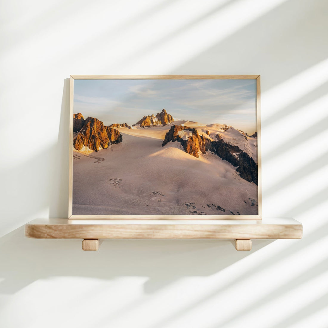 Aiguille du Midi sunset wall art print showcasing soft golden light over snowy alpine peaks in Chamonix.