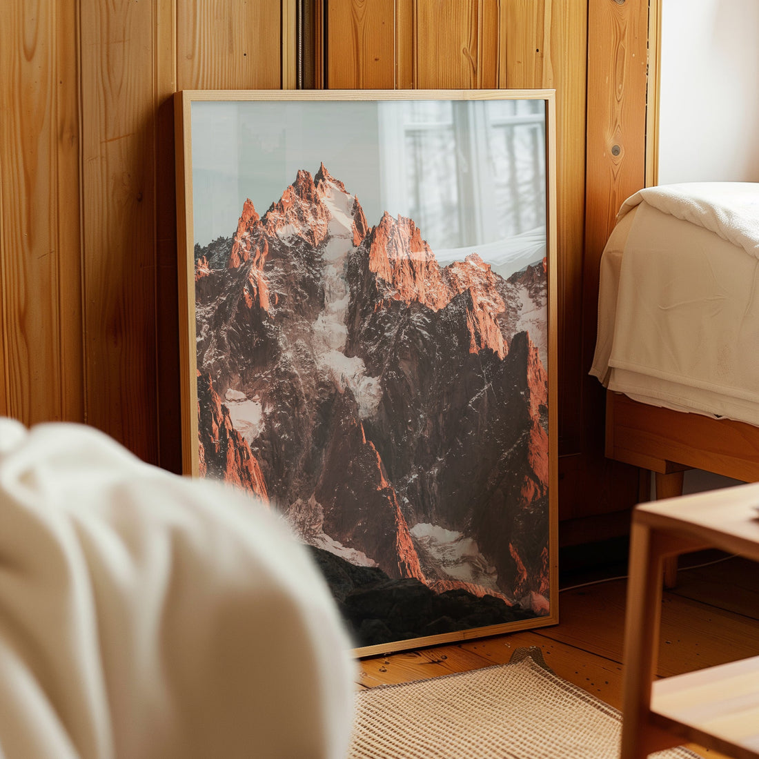 A dramatic landscape print of Aiguille du Midi, bathed in warm light, perfect for mountain lovers.