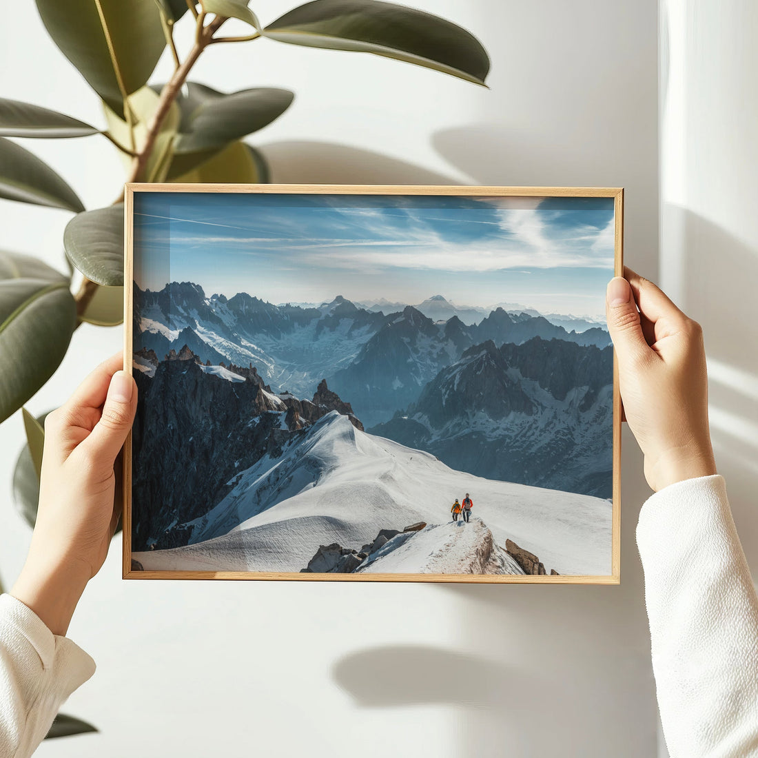 Aiguille du Midi wall art print capturing mountaineers crossing the exposed ridge with dramatic alpine peaks beyond.