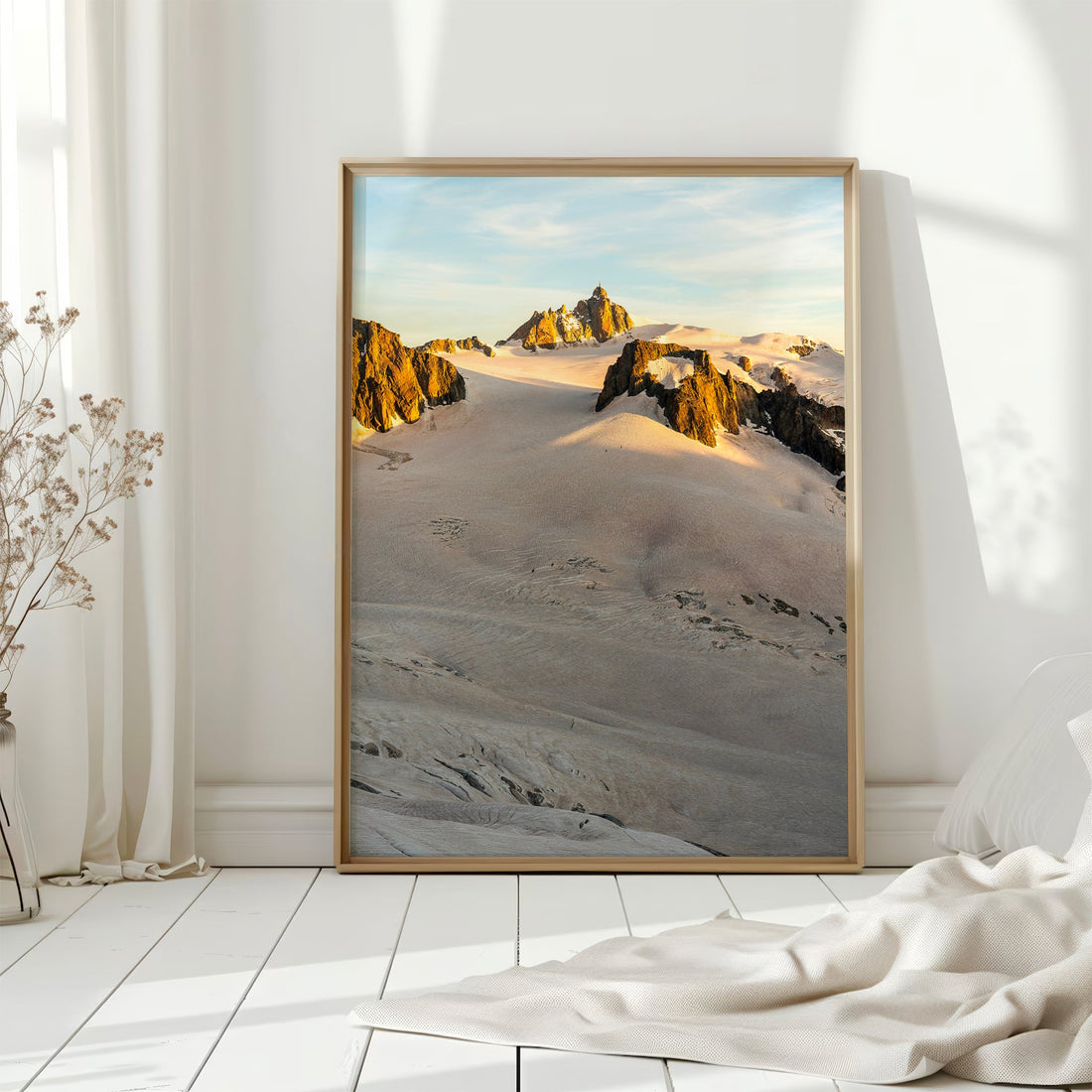 Expansive alpine photography print showcasing the Aiguille du Midi under golden sunrise light.