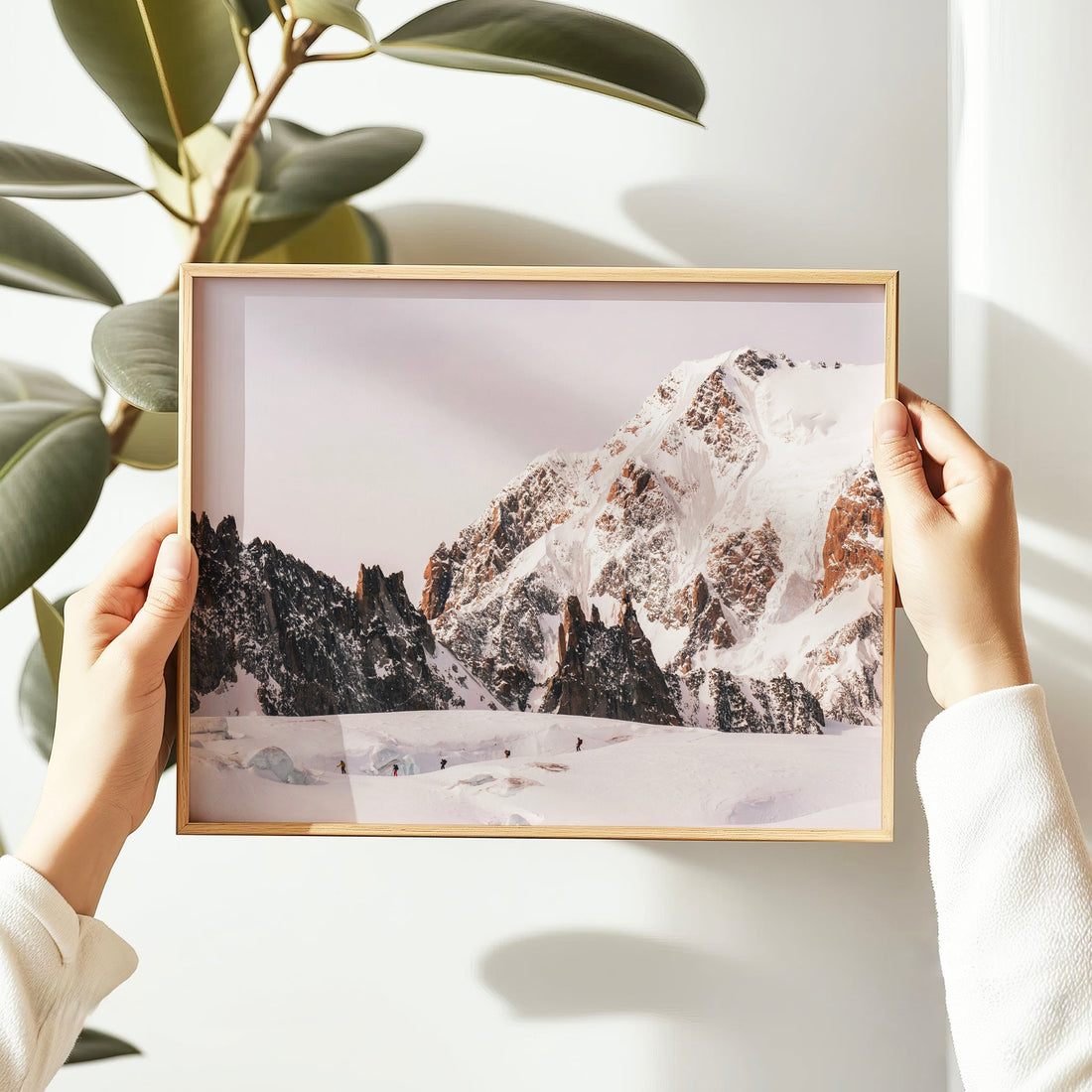 Captivating fine art print of an alpine expedition in the French Alps, with ski mountaineers navigating the icy terrain.