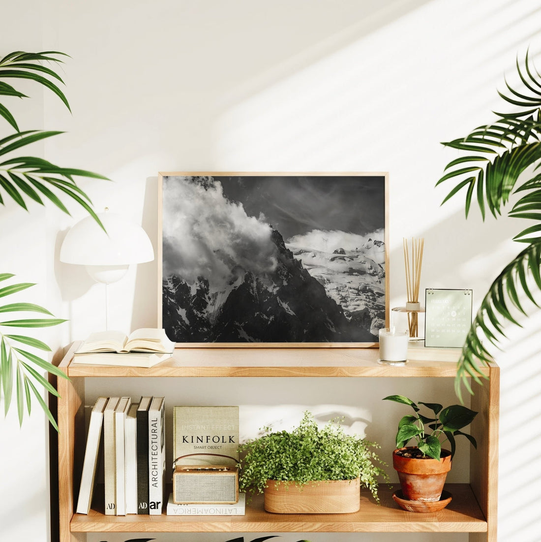 Striking black and white mountain print of Aiguille du Midi rising through dramatic weather near Mont Blanc.