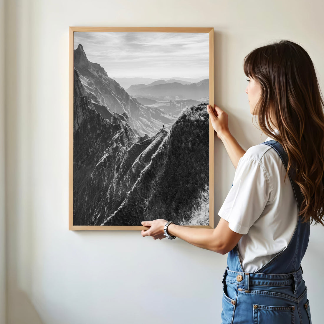 A lone hiker on Schäfler Ridge, overlooking rolling Swiss valleys and jagged alpine peaks.