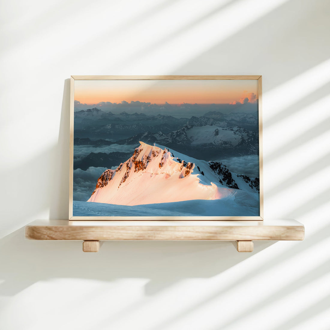 Stunning framed art print of a jagged snowy ridge on Monte Bianco, with a pastel sunset sky over the Alps.
