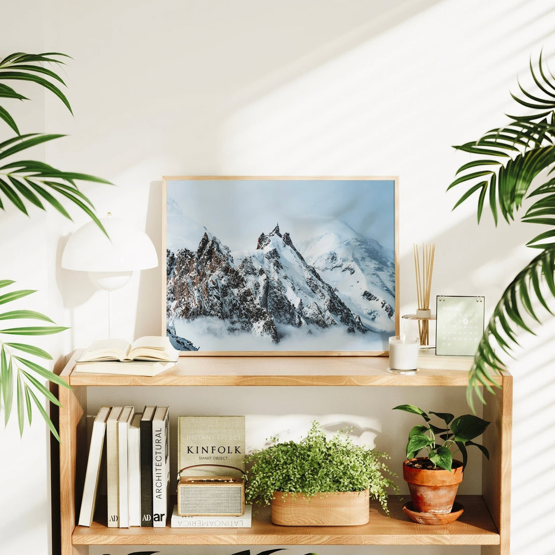Chamonix Alps wall art print styled in a bright, plant-filled room