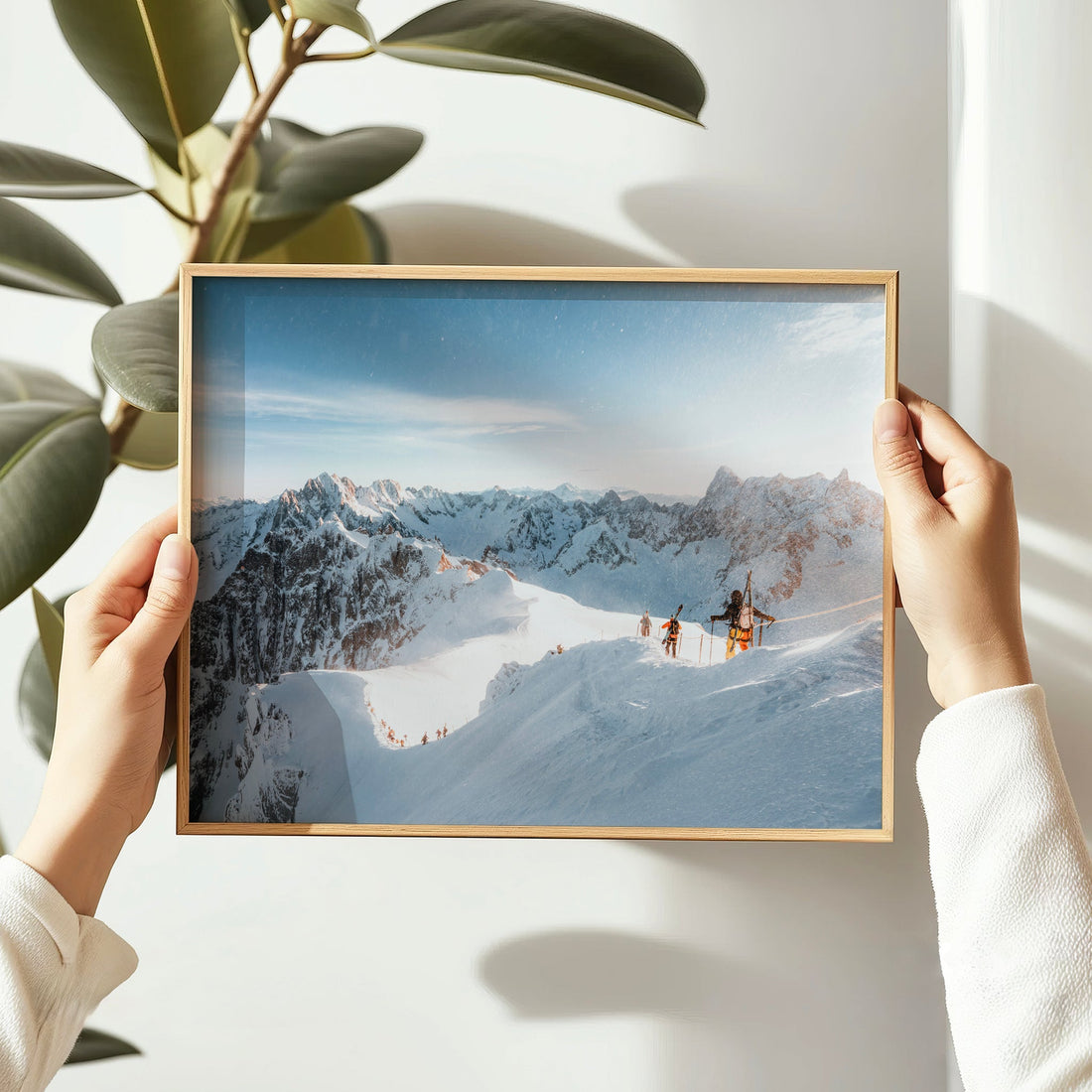 Minimalist photography print of alpine skiers on a snowy ridgeline with panoramic mountain views.