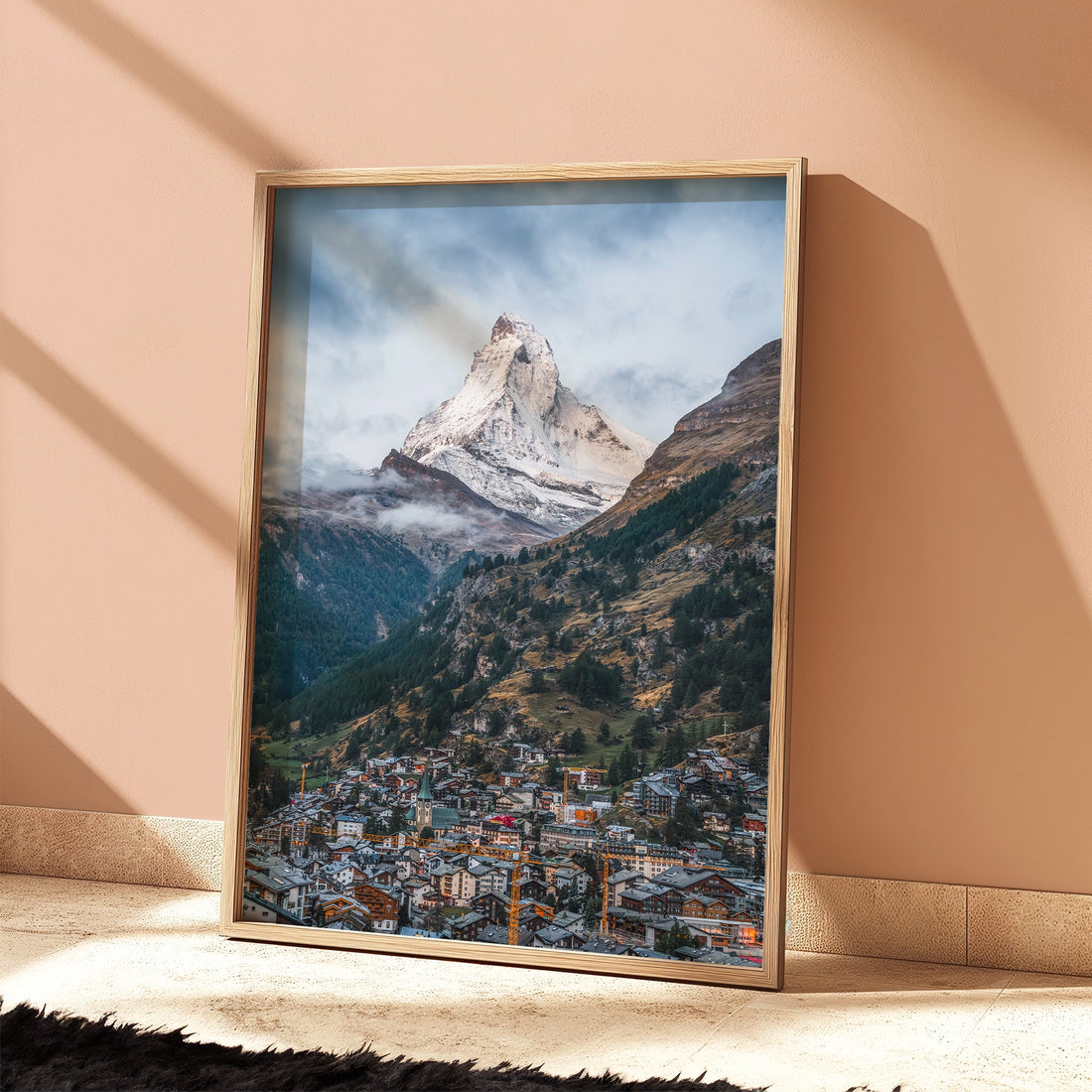 Modern alpine print of the Matterhorn in a sunlit minimalist interior.
