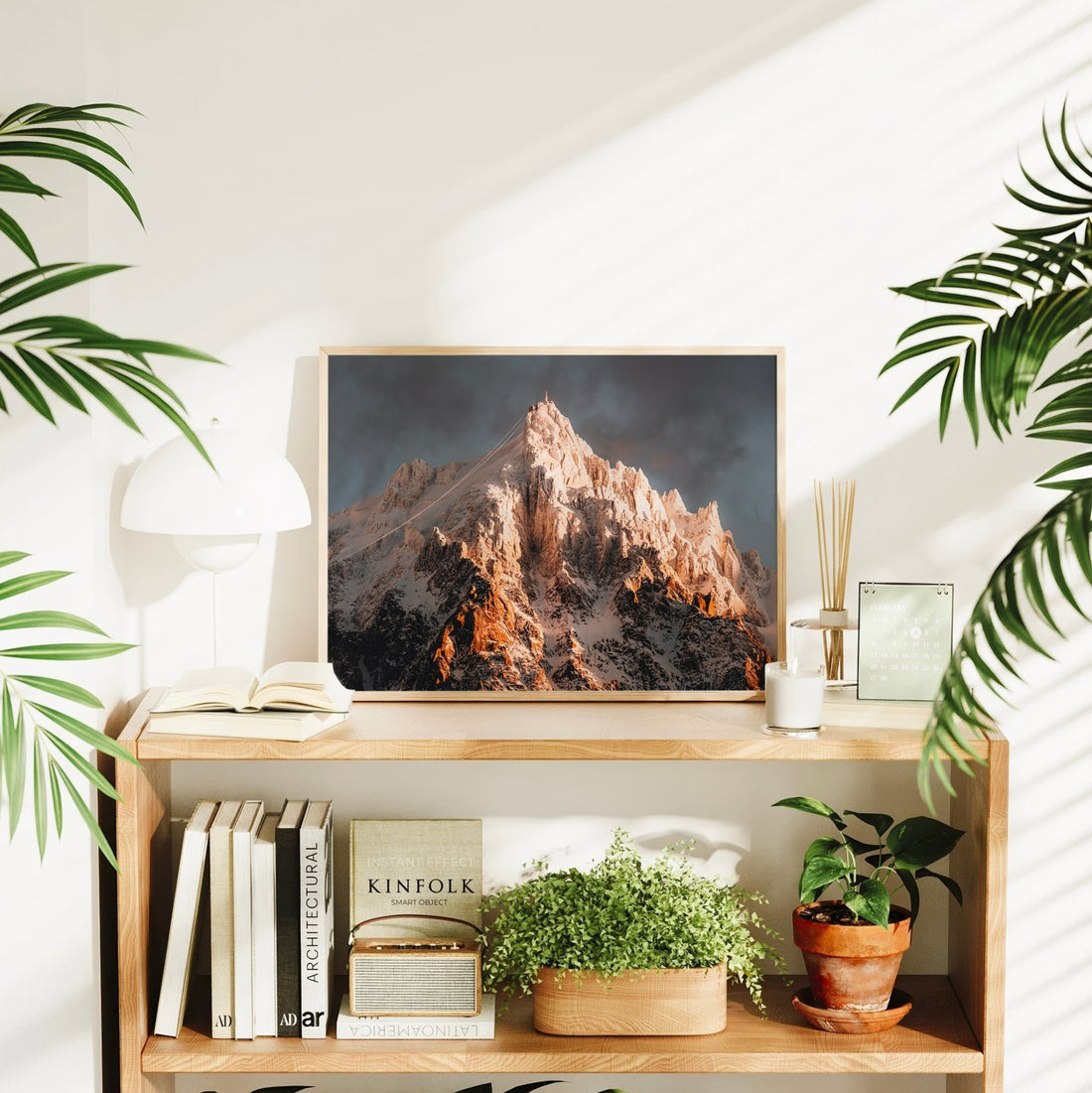 Framed alpine wall art print showing Chamonix’s iconic Aiguille du Midi illuminated by morning light.