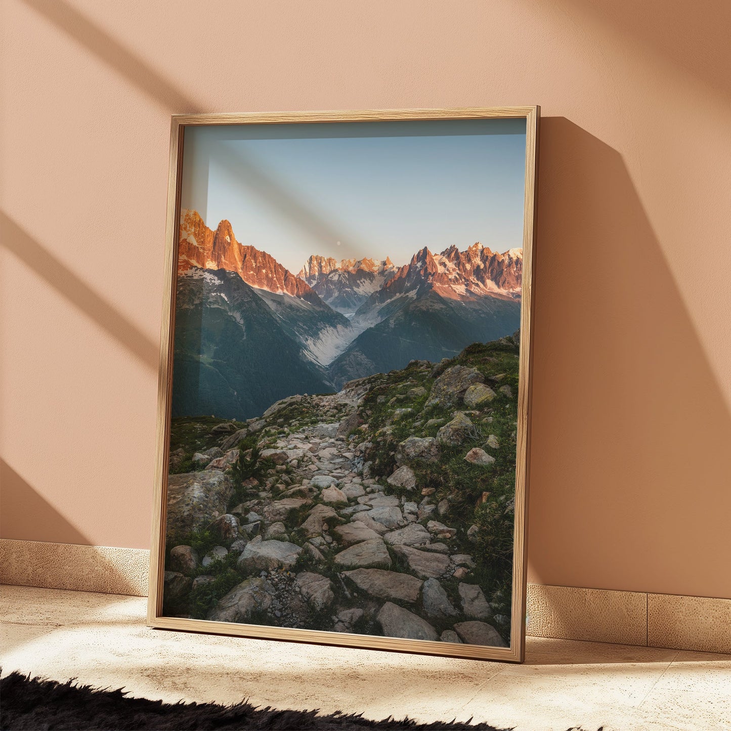 Majestic view of an alpine glacier valley with golden light hitting the mountain peaks.