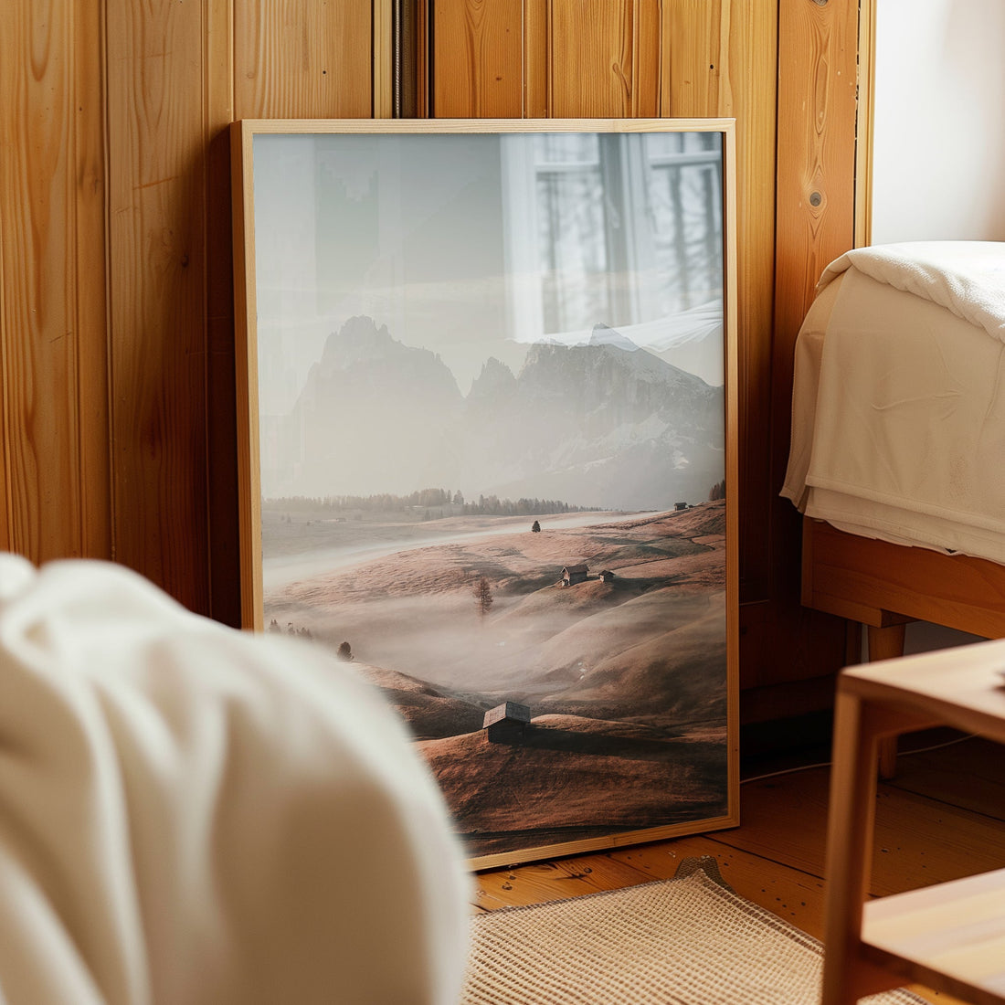 Photography print of misty meadows in the Italian Alps with a backdrop of jagged Dolomite peaks.