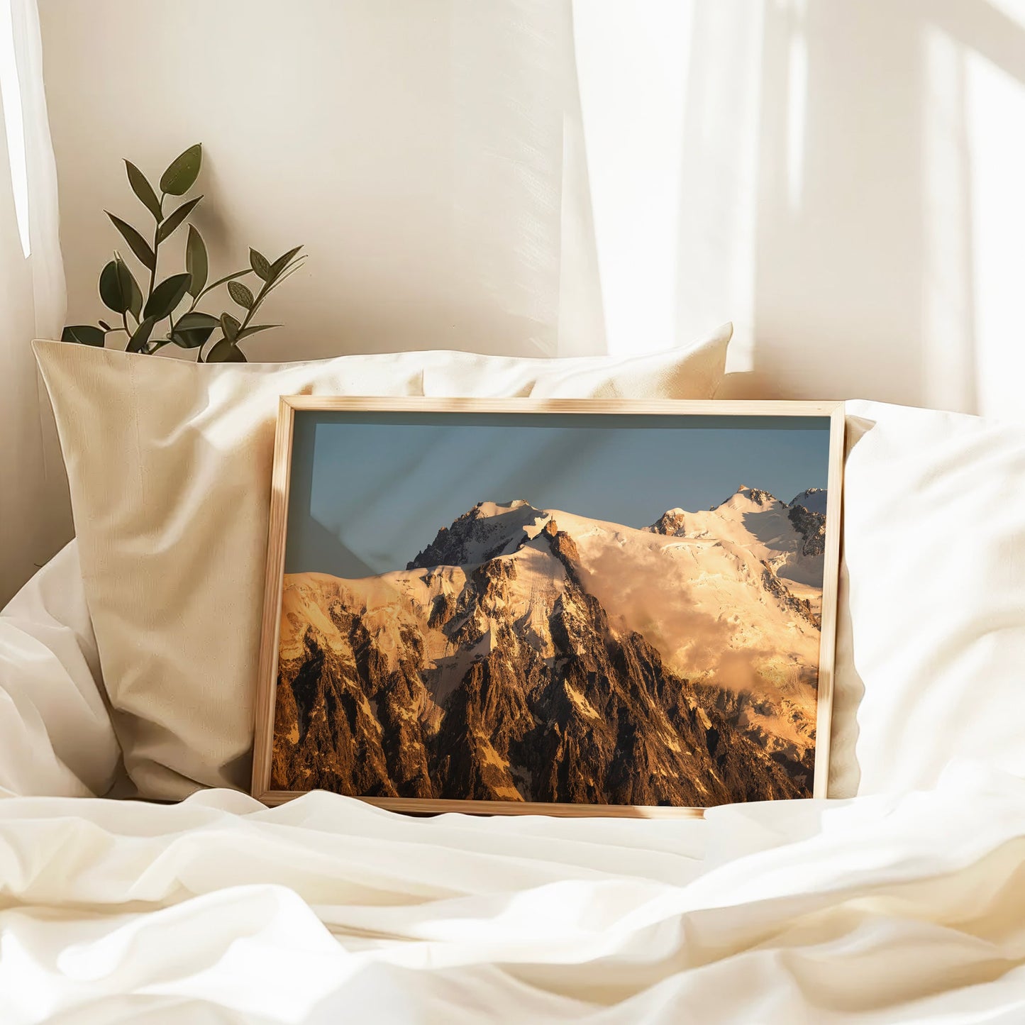 Snow-covered alpine print featuring the Aiguille du Midi summit bathed in morning light, perfect for mountain lovers.