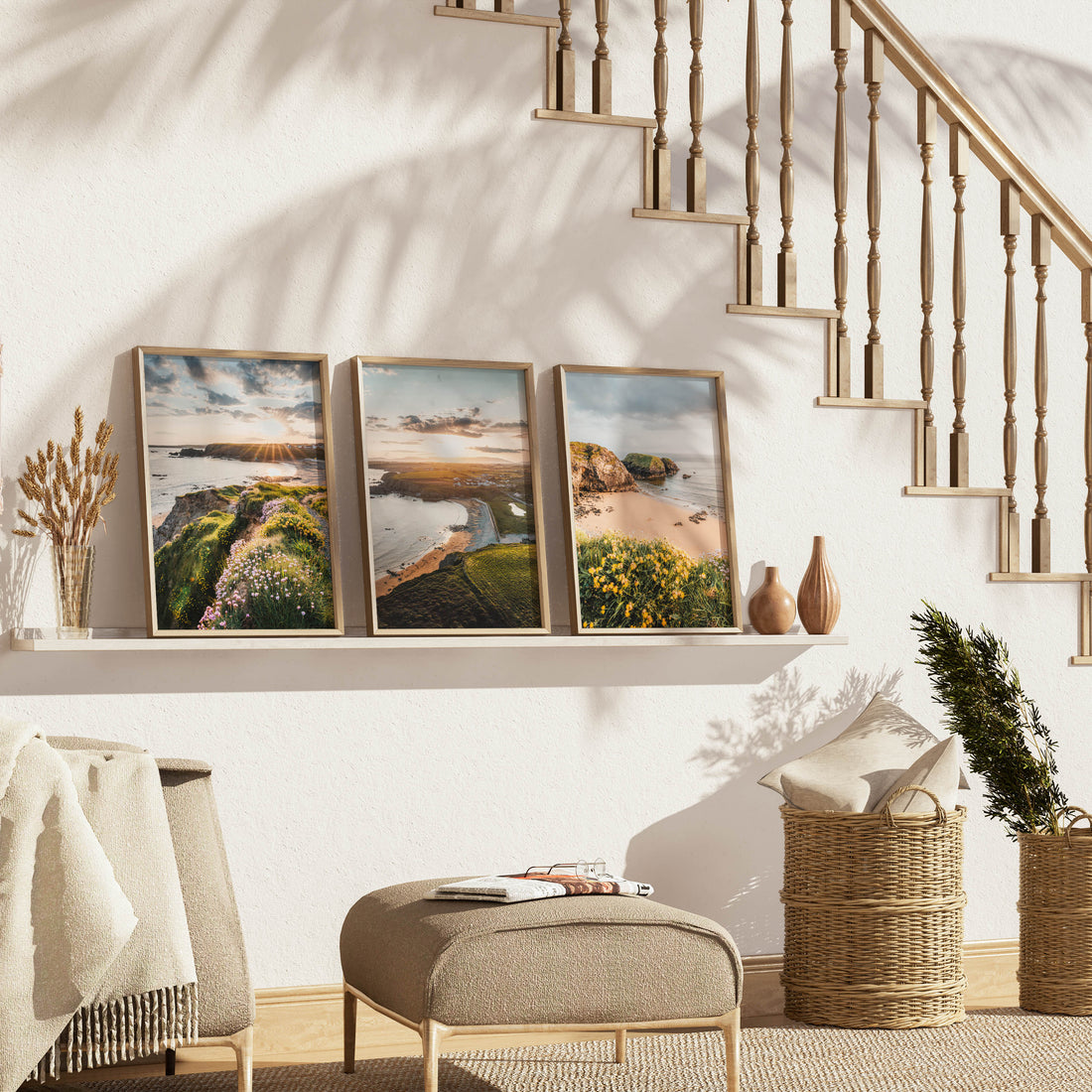 Set of 3 Annestown Beach wall art prints beneath staircase in warm natural home interior – Irish coastal photography triptych