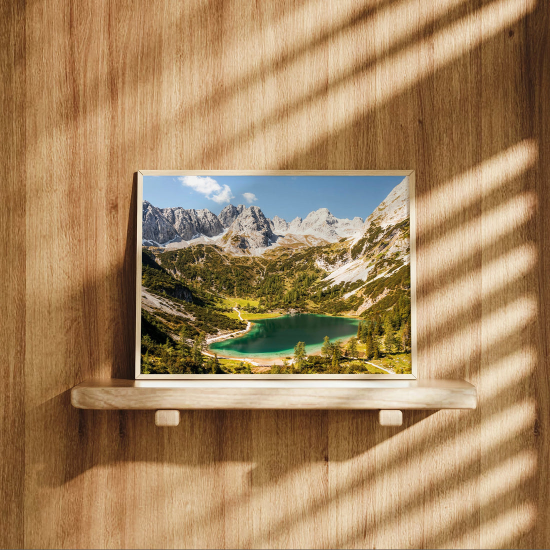 Seebensee mountain lake wall print on wooden shelf with dramatic lighting