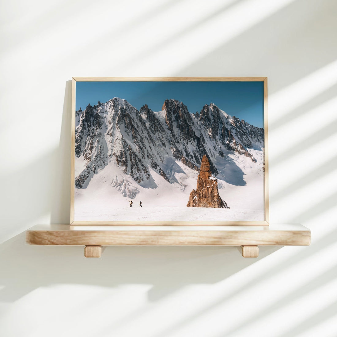 Stunning wall art print of backcountry skiing adventure through the snowy glacier valley of Chamonix.