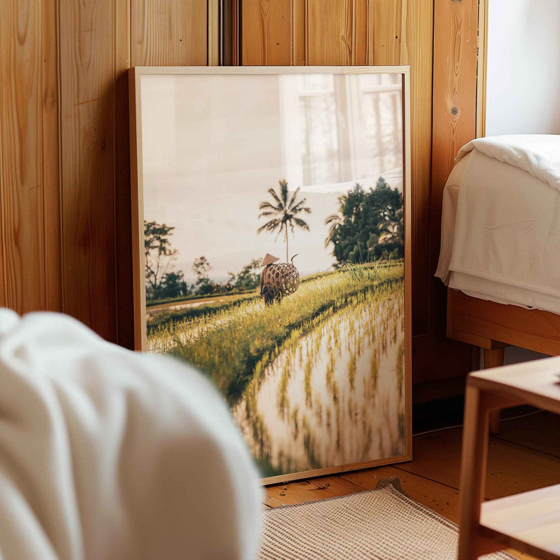 Framed Bali wall art print of rice fields displayed in a neutral living room interior