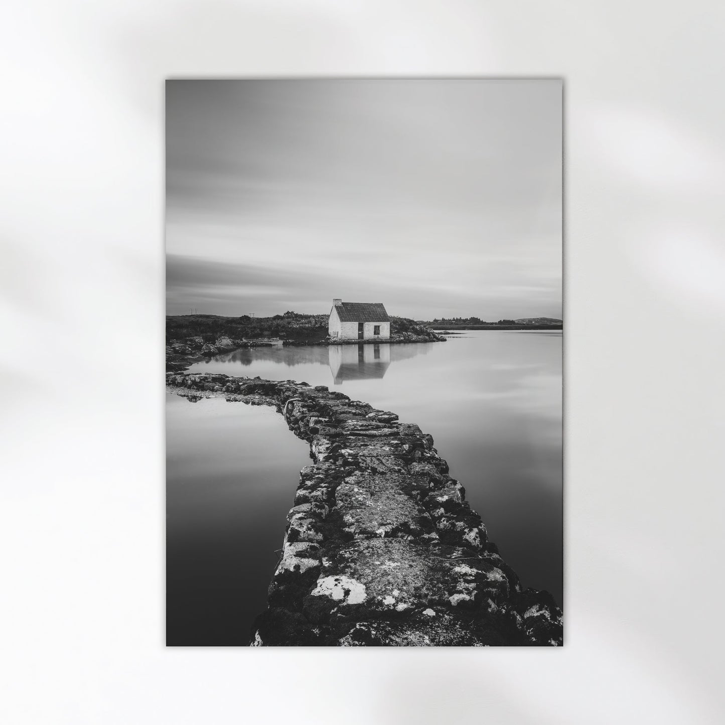 Fine art wall print of an Irish bothy by the water, in monochrome.