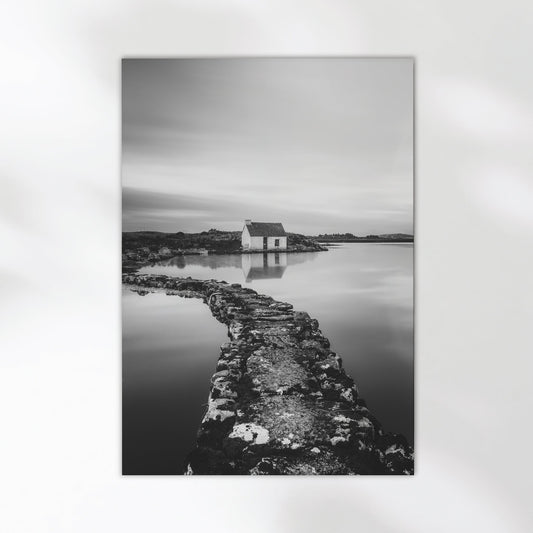 Fine art wall print of an Irish bothy by the water, in monochrome.