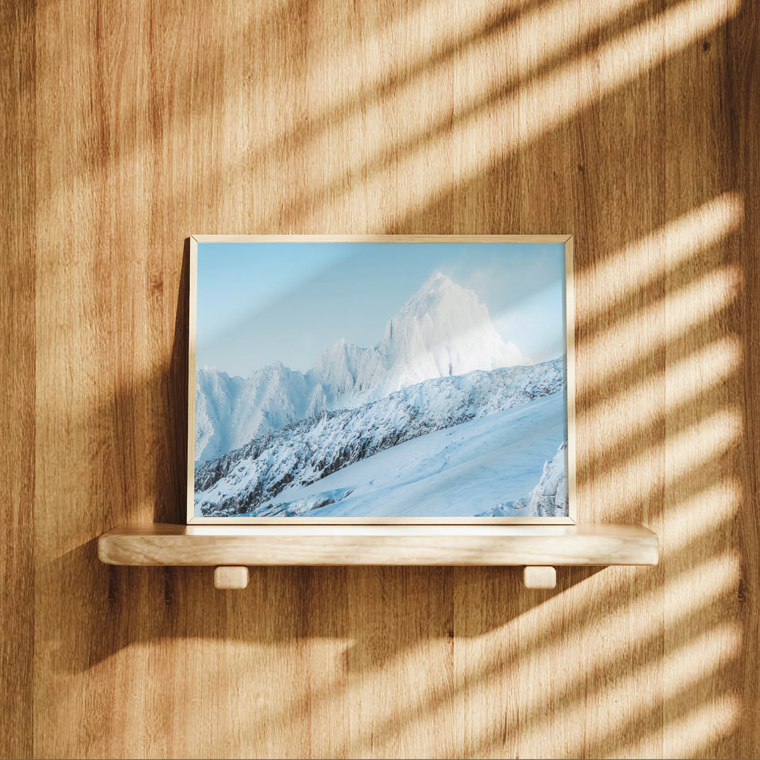 Serene alpine photography print with clear blue skies above the Aiguille du Chardonnet's icy summit.