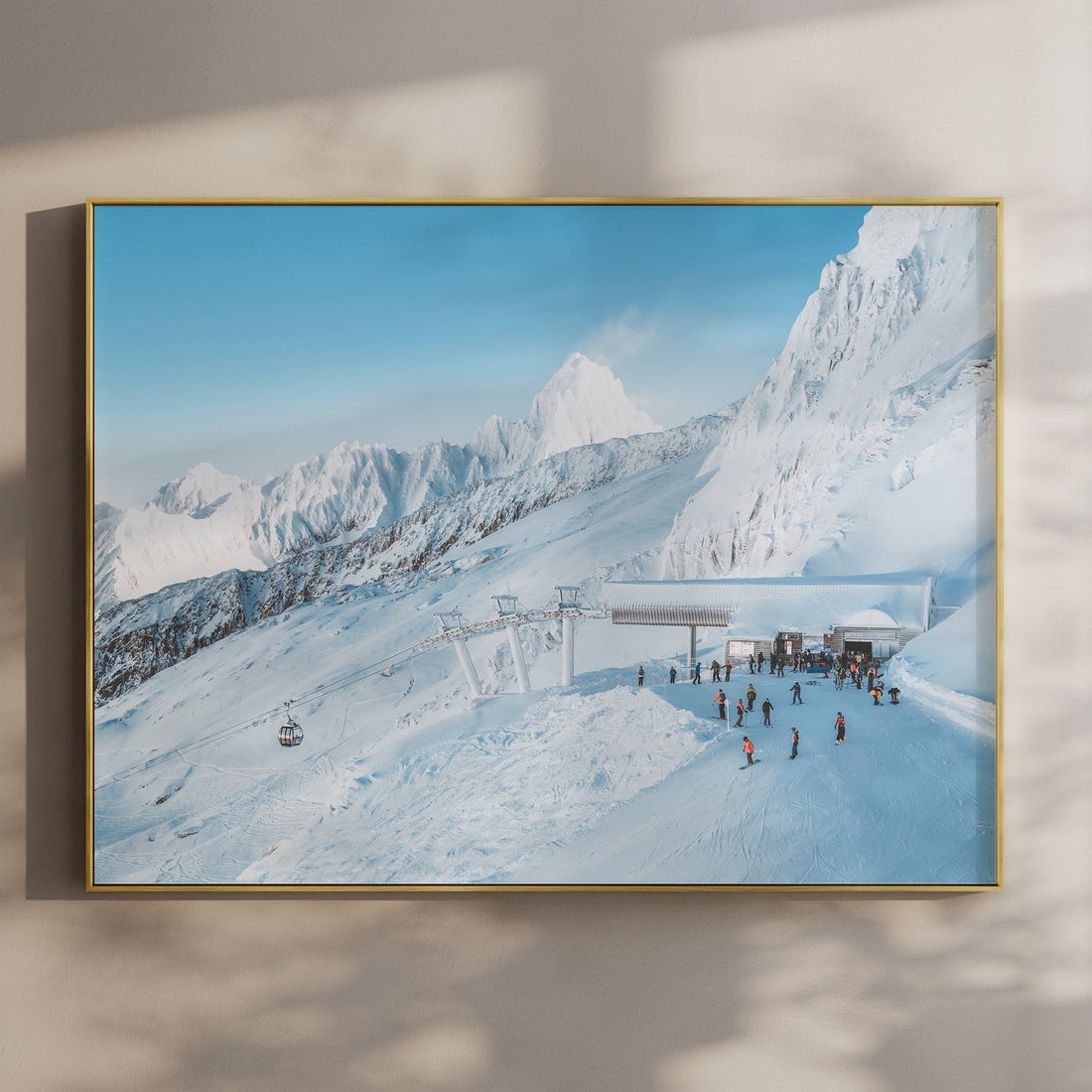 Chamonix ski lift wall art print featuring the snowy Bochard station in the French Alps under blue skies.