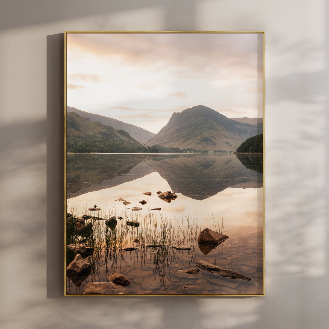 Framed fine art print of Buttermere in the Lake District at sunset with mountain reflections.