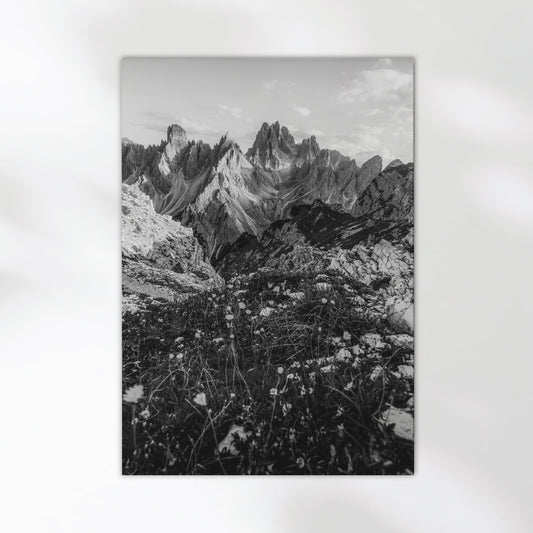Black and white Dolomites photo print of the Cadini di Misurina placed flat against a white wall.