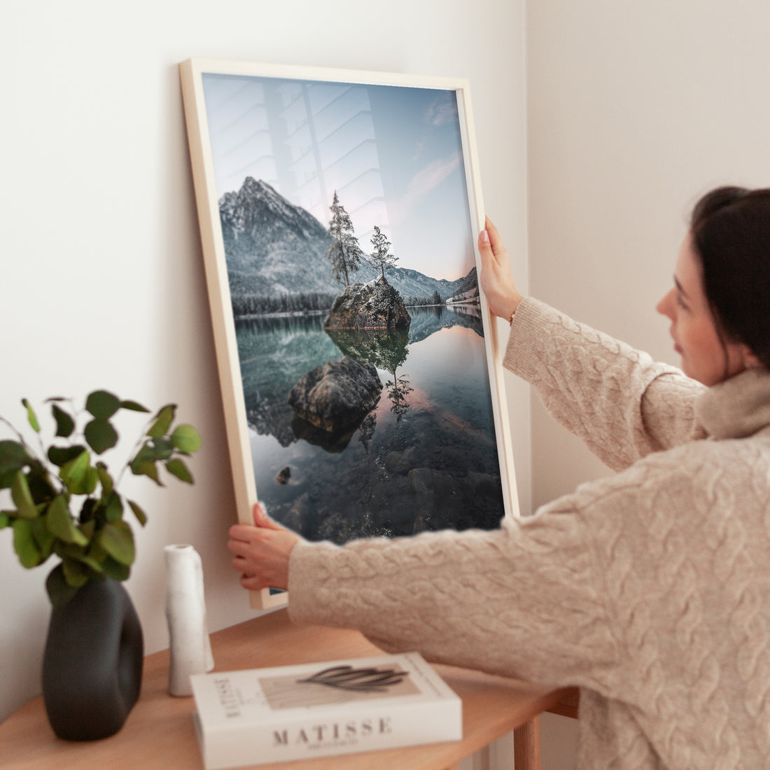 Calm lake scene at Hintersee surrounded by forest and rocky peaks