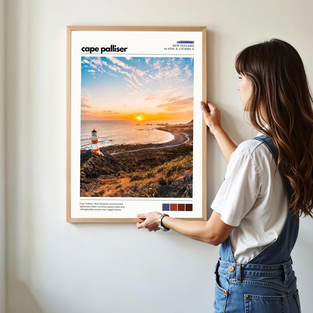 Person hanging a Cape Palliser wall art print showing scale and proportions