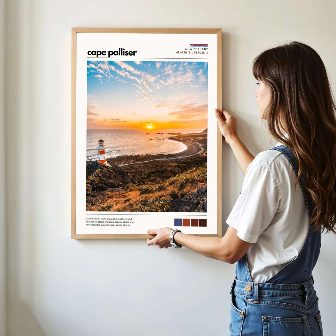 Person hanging a Cape Palliser wall art print showing scale and proportions