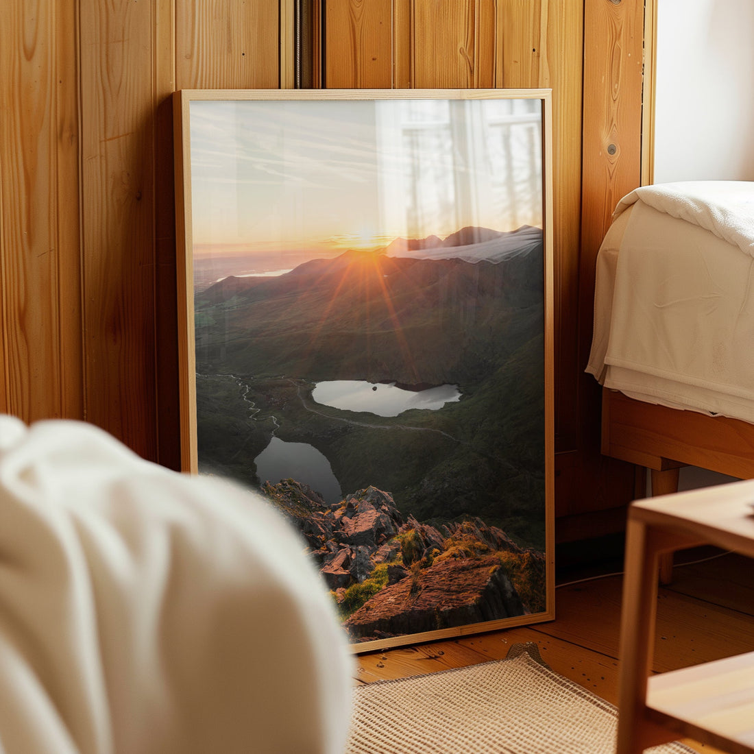 Framed Carrauntoohil sunrise photo leaning in cosy wood-panelled room