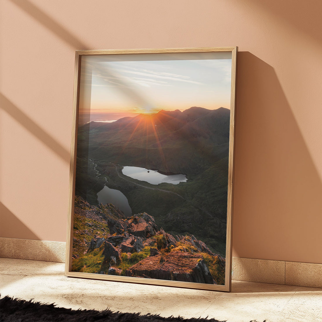 Framed Carrauntoohil mountain print glowing in soft peach morning light