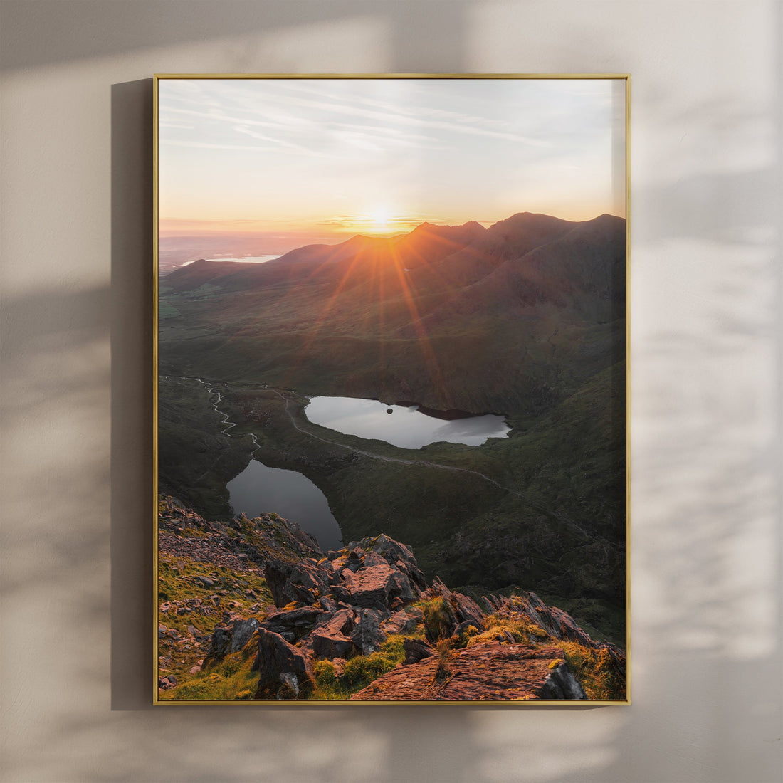 Carrauntoohil at sunrise with sunburst over Irish mountains and lakes