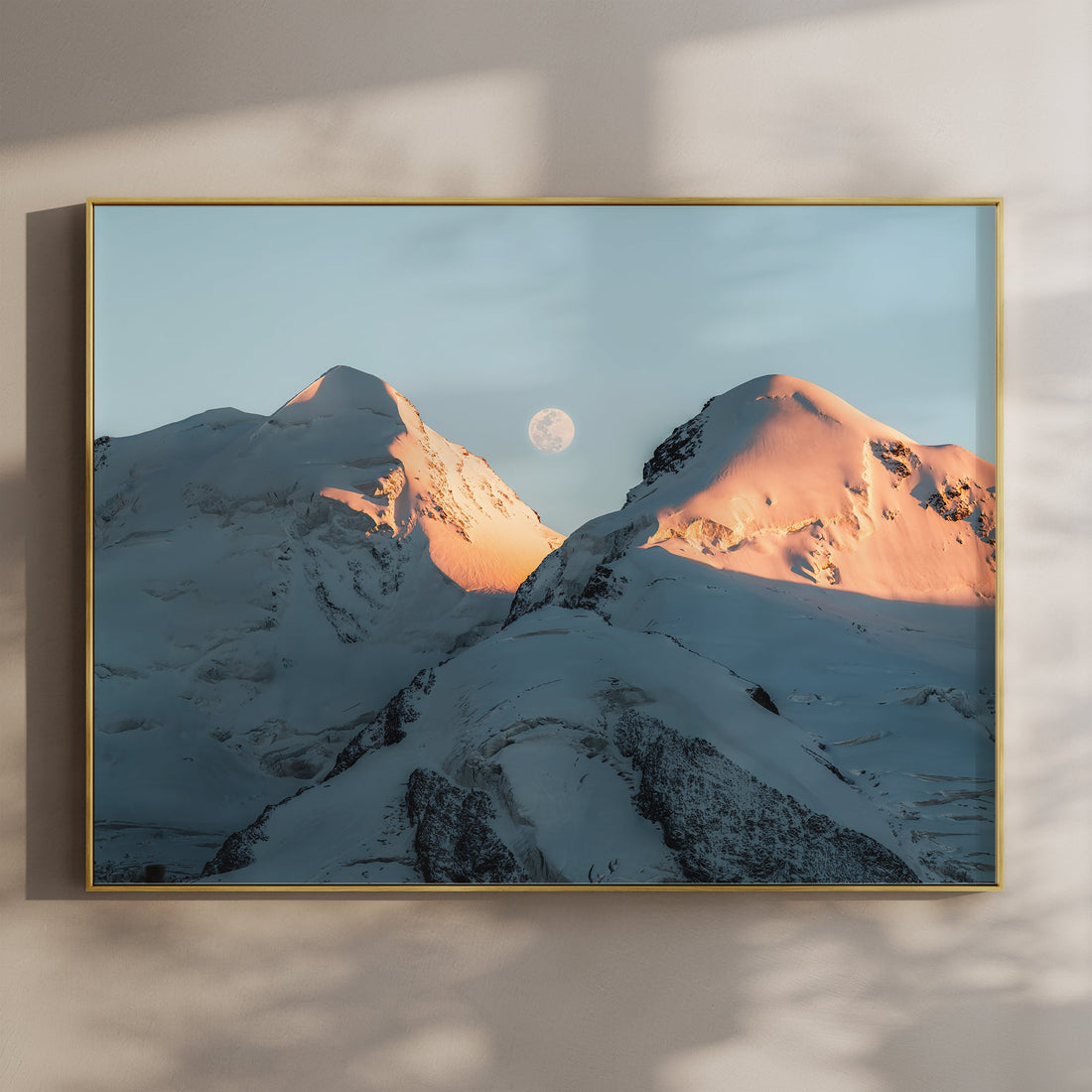 Fine art print of Castor and Pollux peaks glowing at sunrise in the Swiss Alps with a full moon between summits.