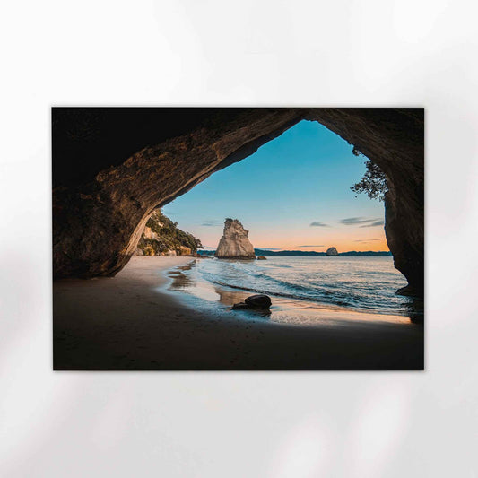 Unframed Cathedral Cove fine art print on white background showing iconic rock arch framing Te Hoho Rock and sandy beach at sunrise