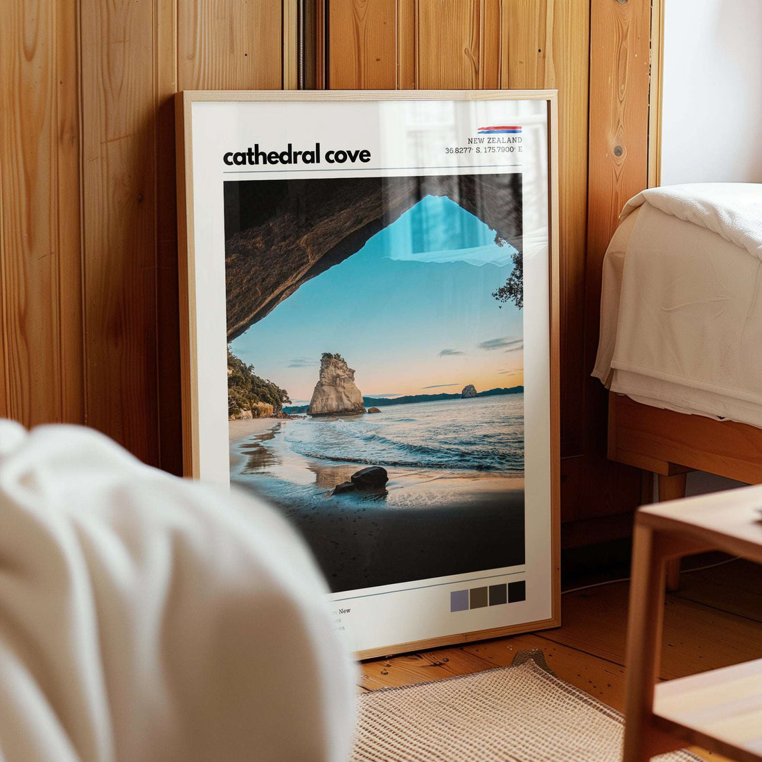 Cathedral Cove wall art print displayed in a calm bedroom interior with natural light