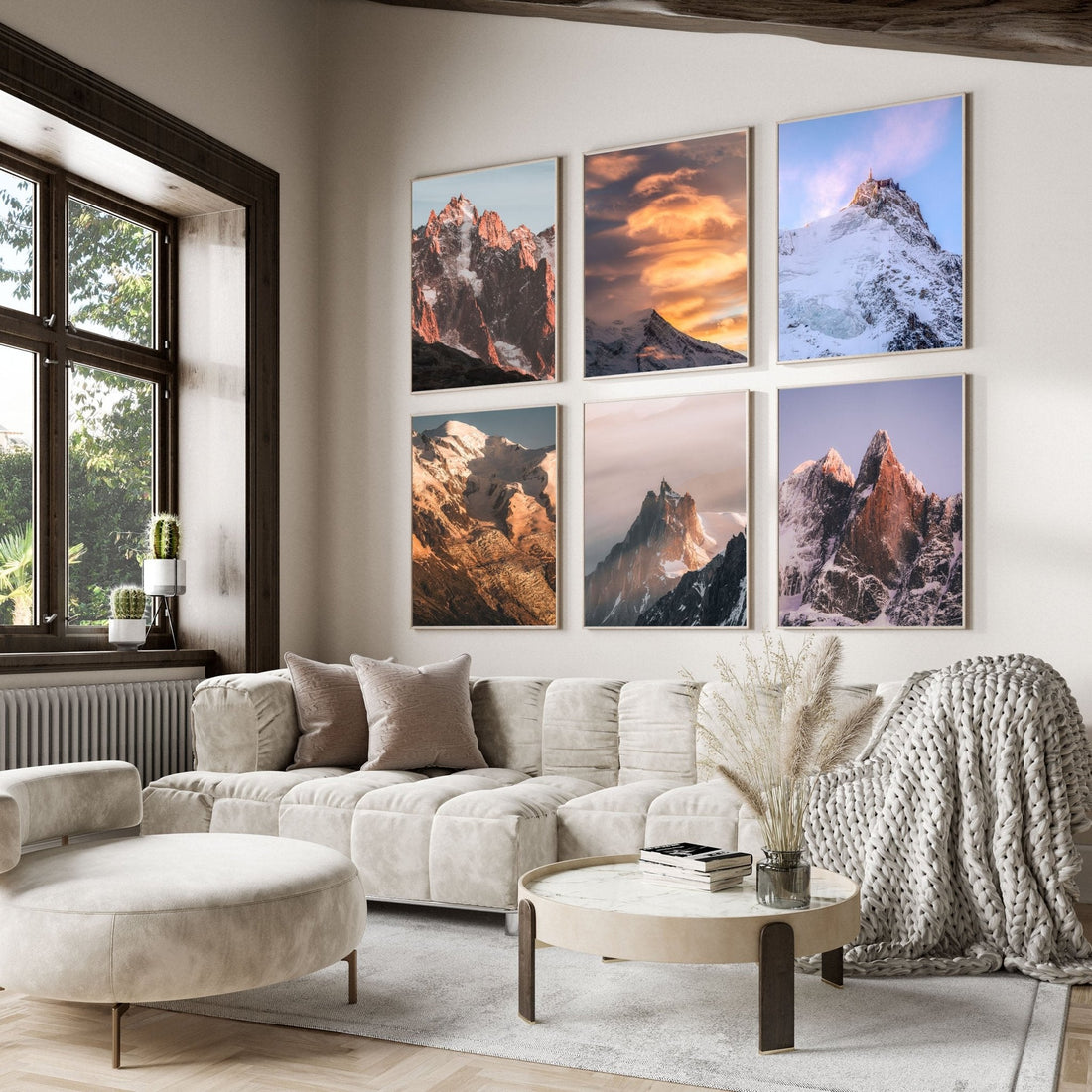 Modern living room with six French Alps prints, including Mont Blanc and Aiguille du Midi, styled in white frames.