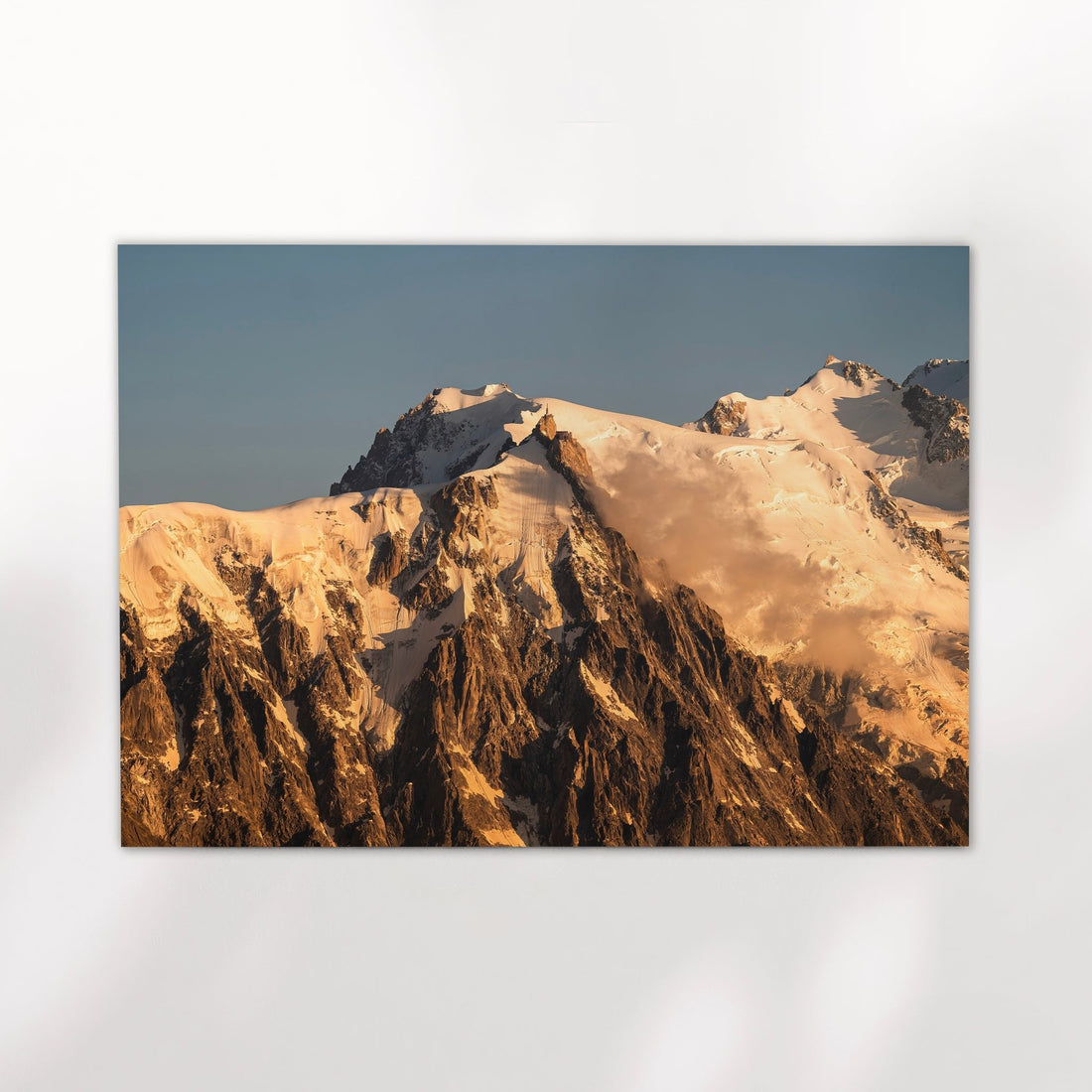 Fine art landscape photography print of Aiguille du Midi glowing at sunrise, overlooking Chamonix in the French Alps.