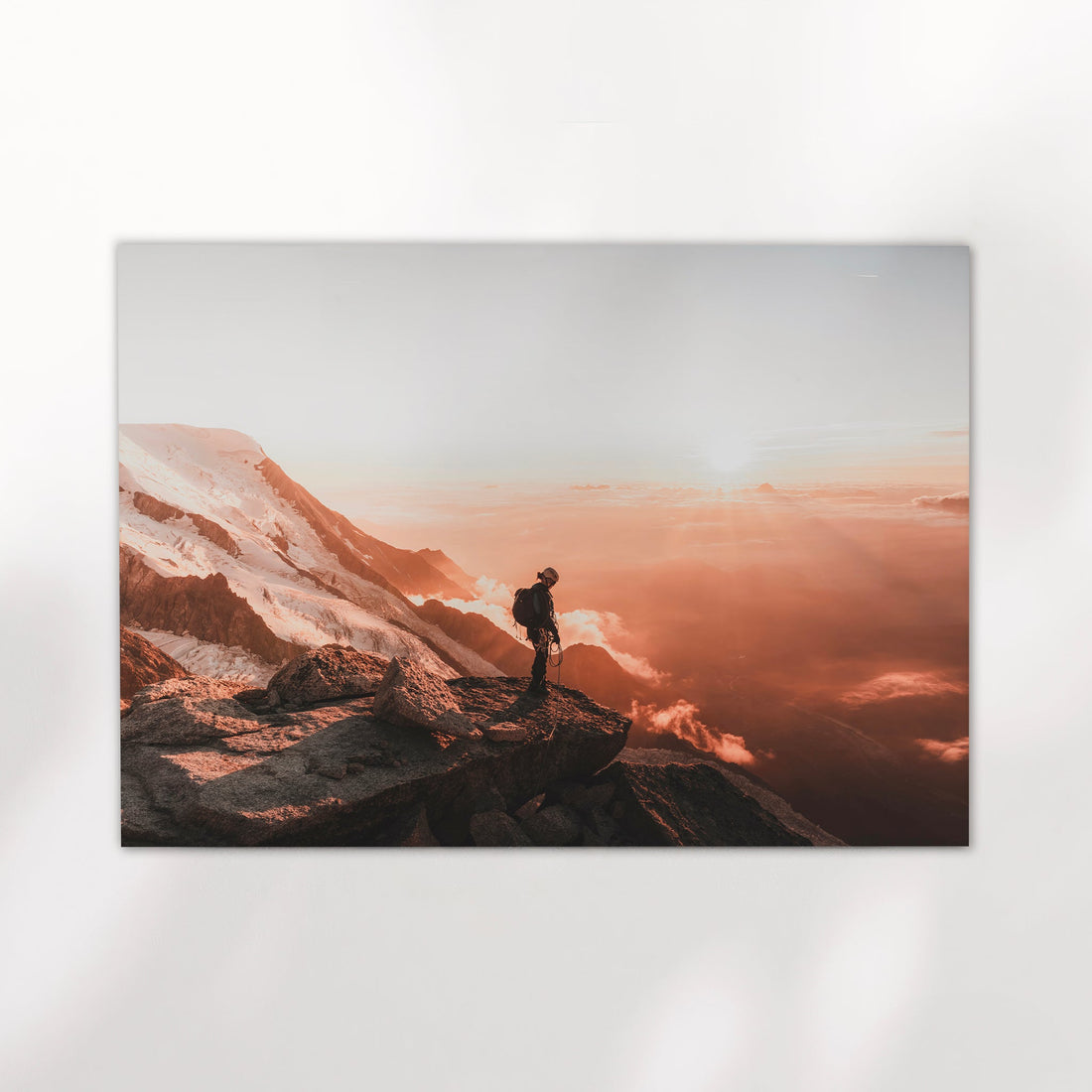 Breathtaking Chamonix alpine adventure wall art showcasing a hiker at the edge of a rugged peak.