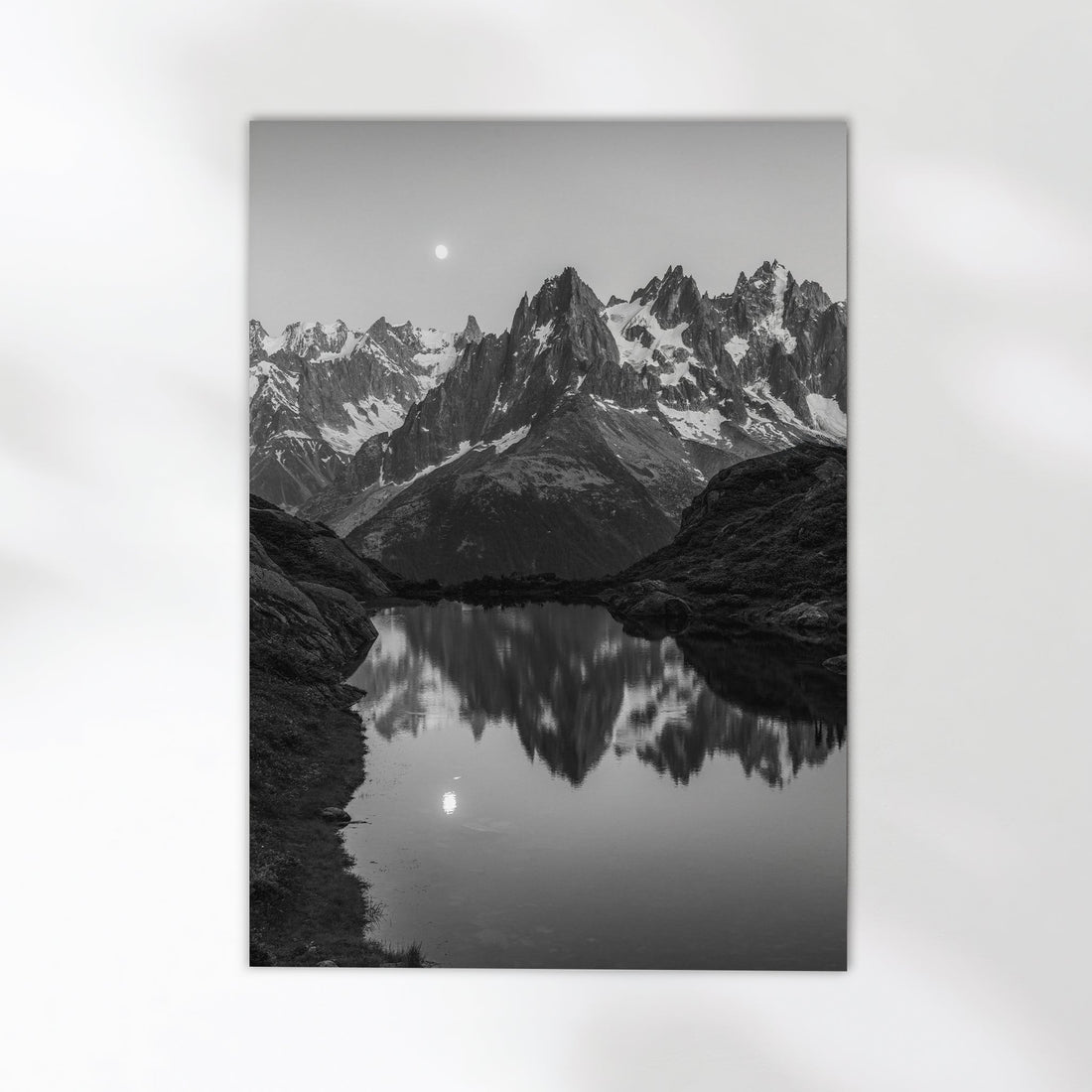 Serene mountain lake print from Chamonix, France, showcasing the dramatic peaks mirrored in calm waters.